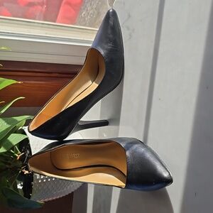 Nine West classic black pumps.